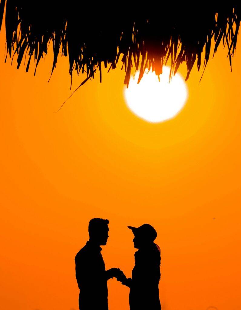 "Real love story of a couple in love during sunset"